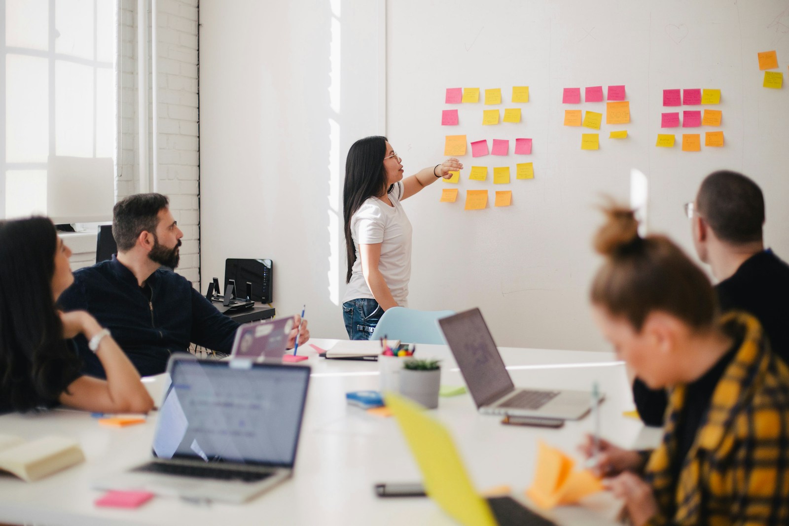 Woman presenting financial charts in a business meeting